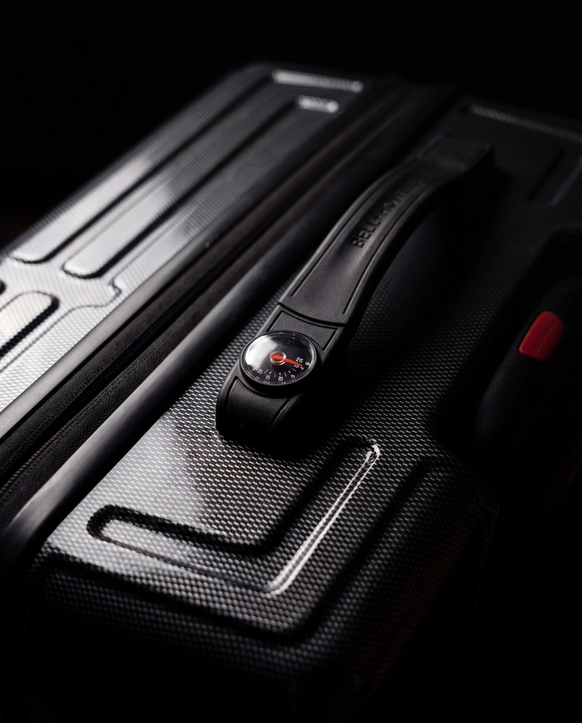 Built-in analog luggage scale integrated into the Bell + Howell suitcase handle