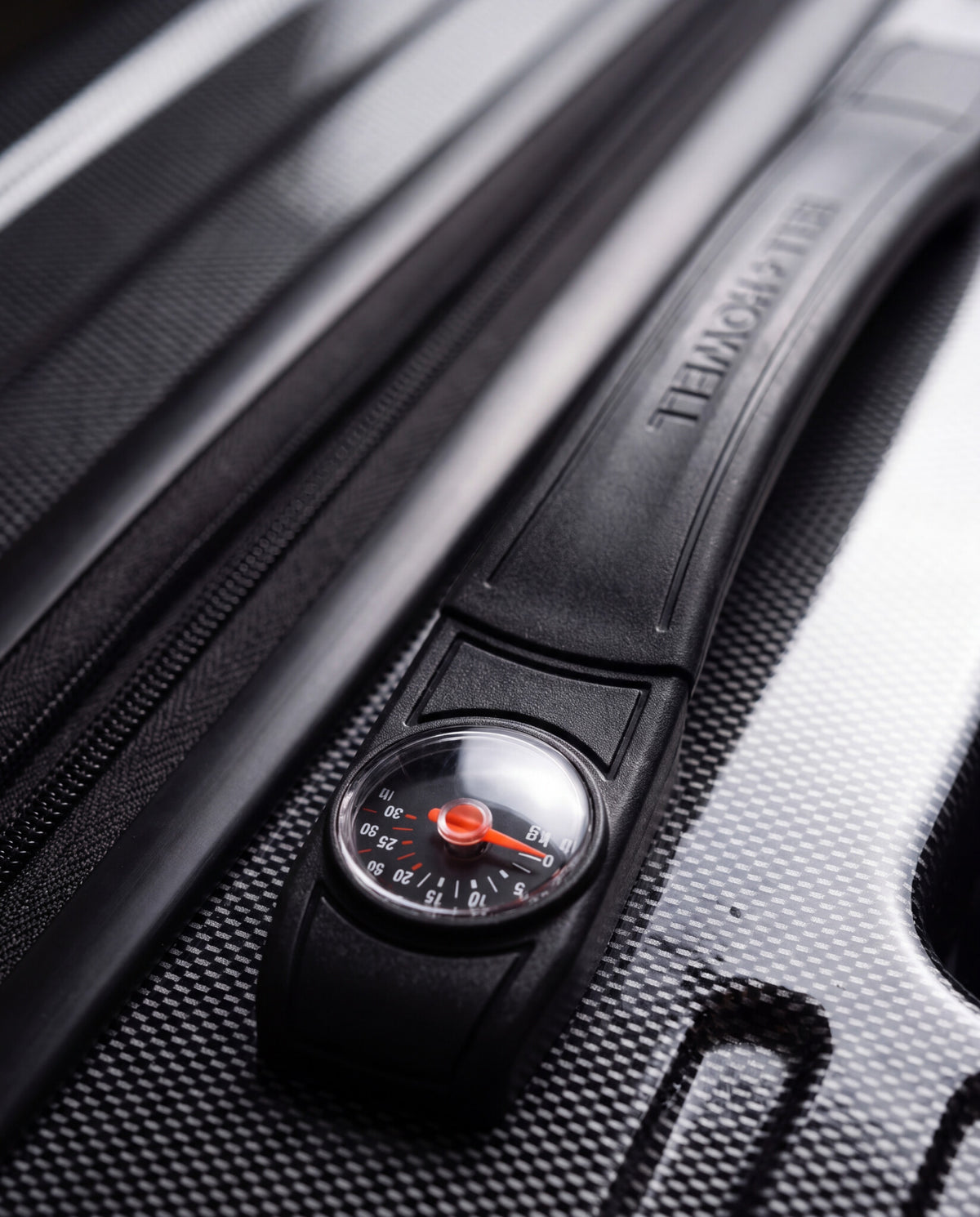 Close-up showing the built-in luggage scale positioned in the suitcase handle